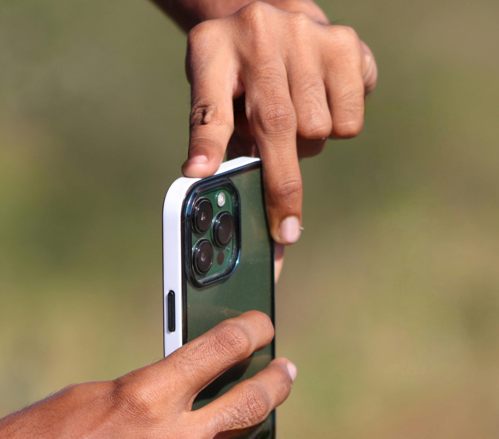Hands holding a smartphone before starting repair intake
