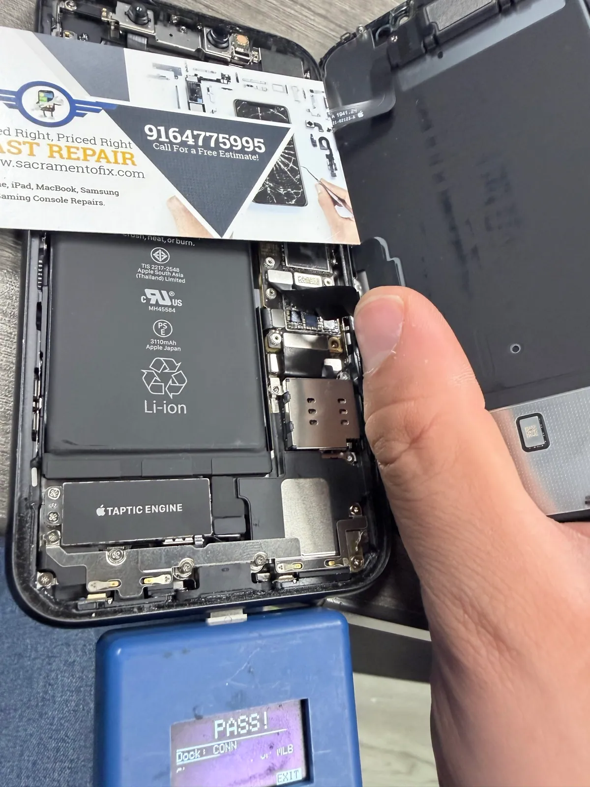 iPhone 11 logic board installed while charging circuit tester shows pass