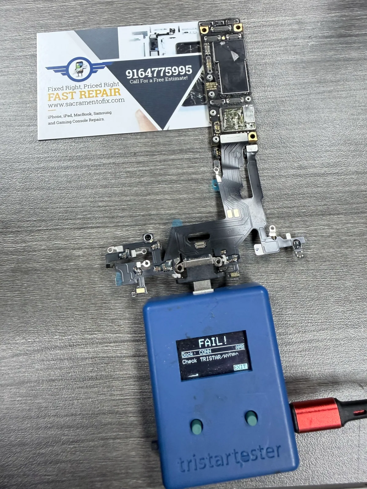 TriStar tester showing fail before iPhone 11 logic board repair in Sacramento