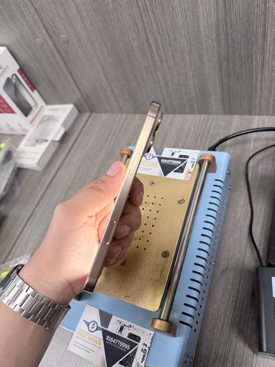 Fast Repair technician testing iPhone display after repair
